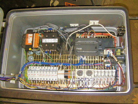 New plc and operator controls for plastic welder. Integrated adjustable electric over air pressure.